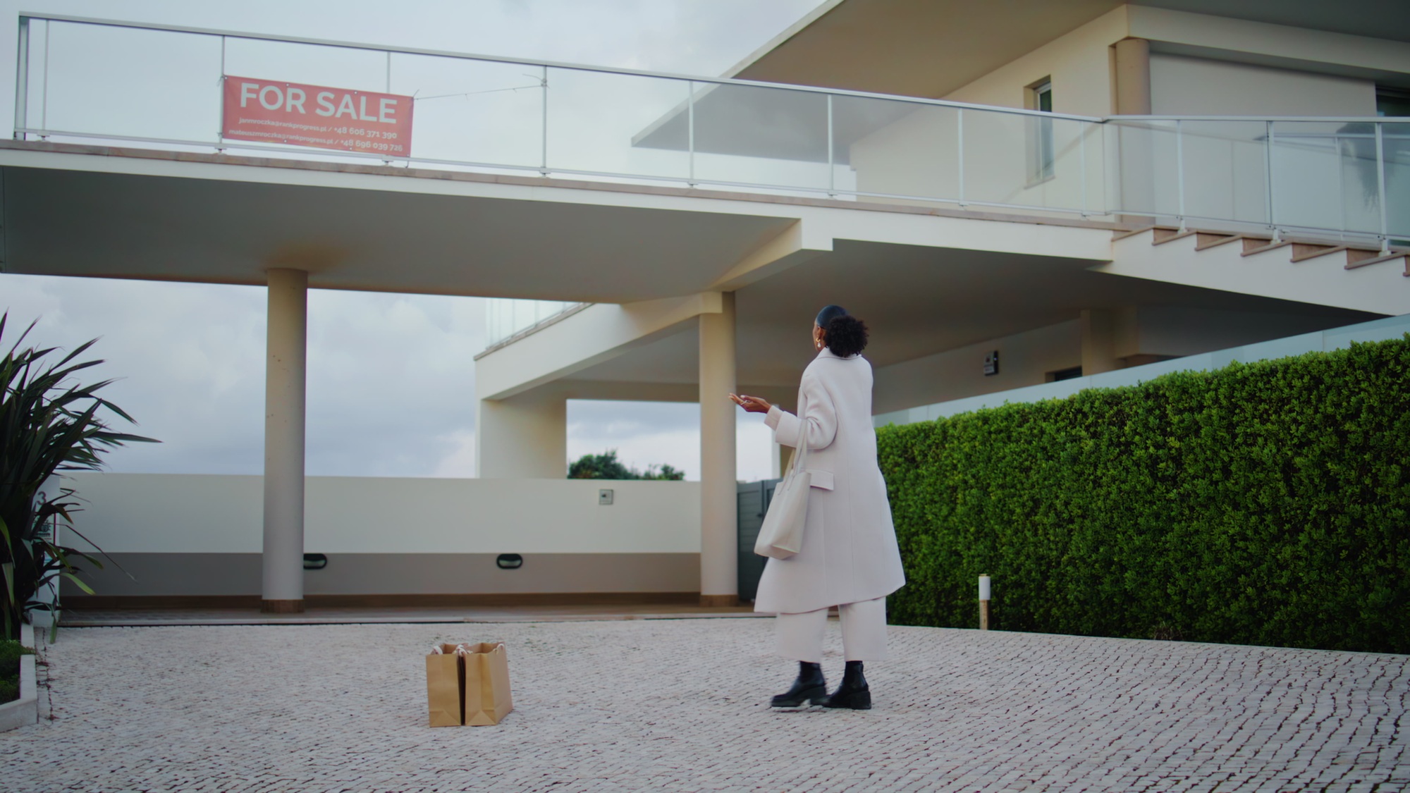 Woman checking real estate for sale. Client looking sign call realtor landlord.